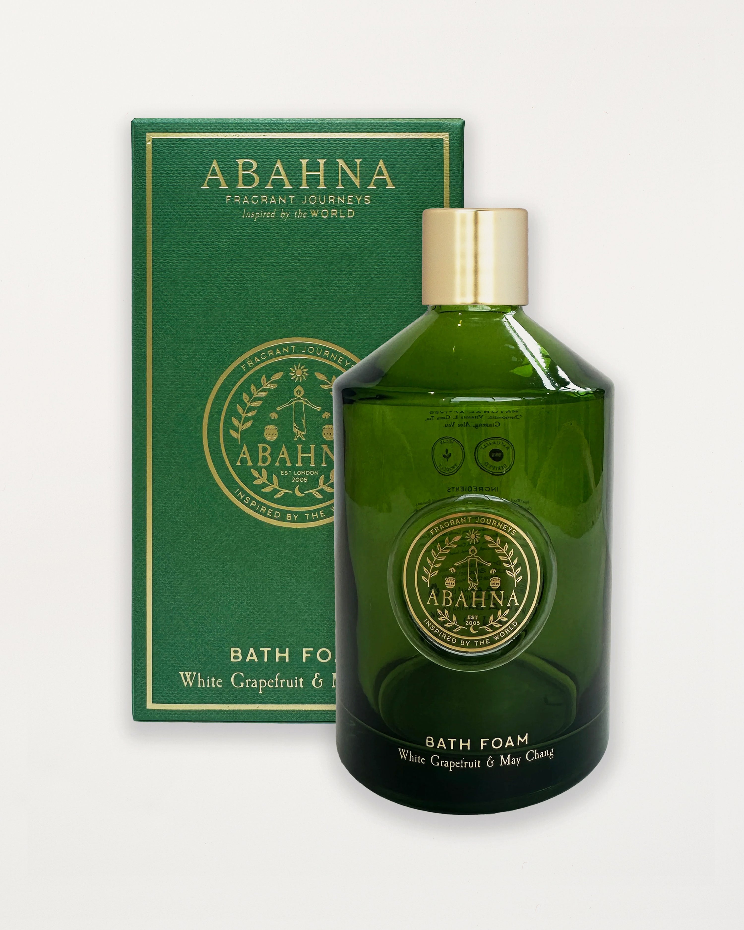 Green bath foam bottle with gold cap and 'Abahana' branding on a white background