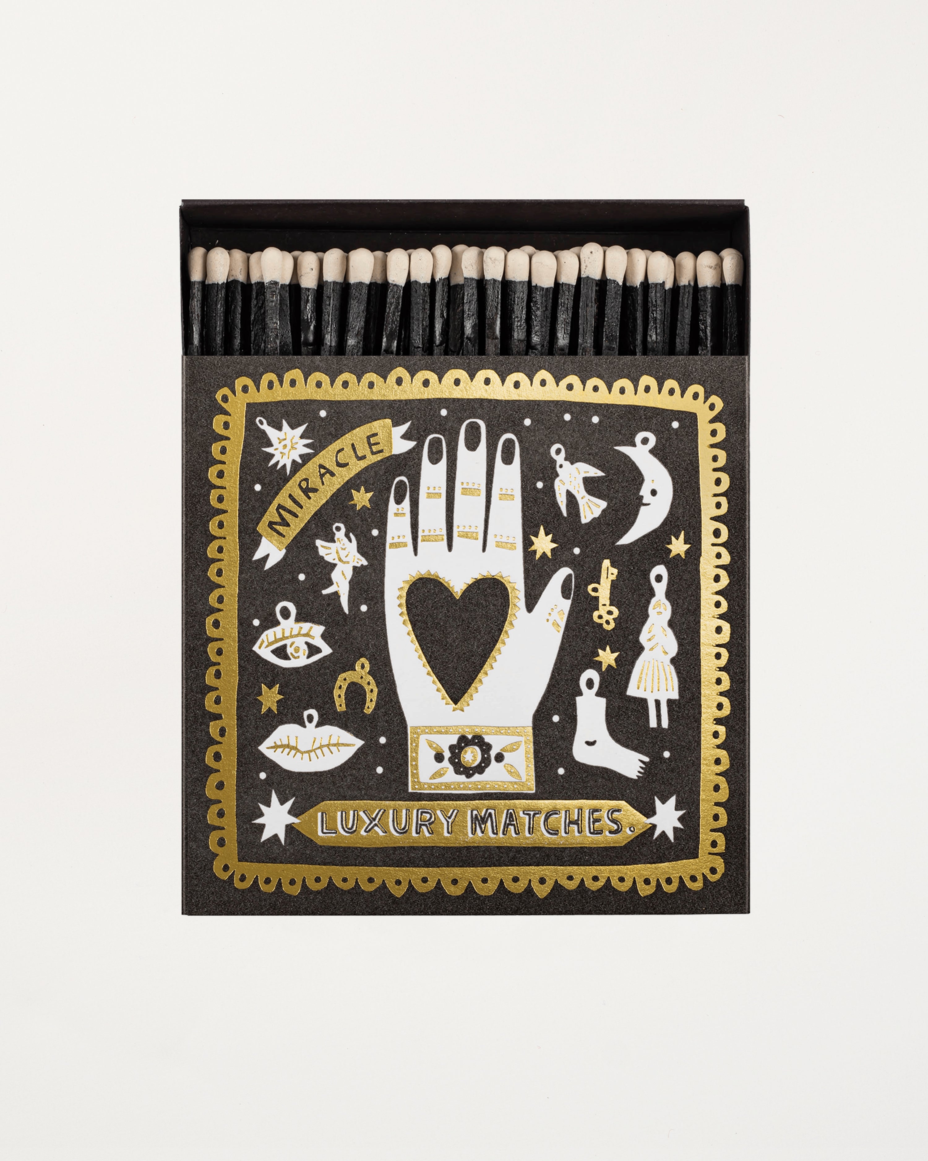 Matchbox with decorative cover featuring illustrations and text on a white background