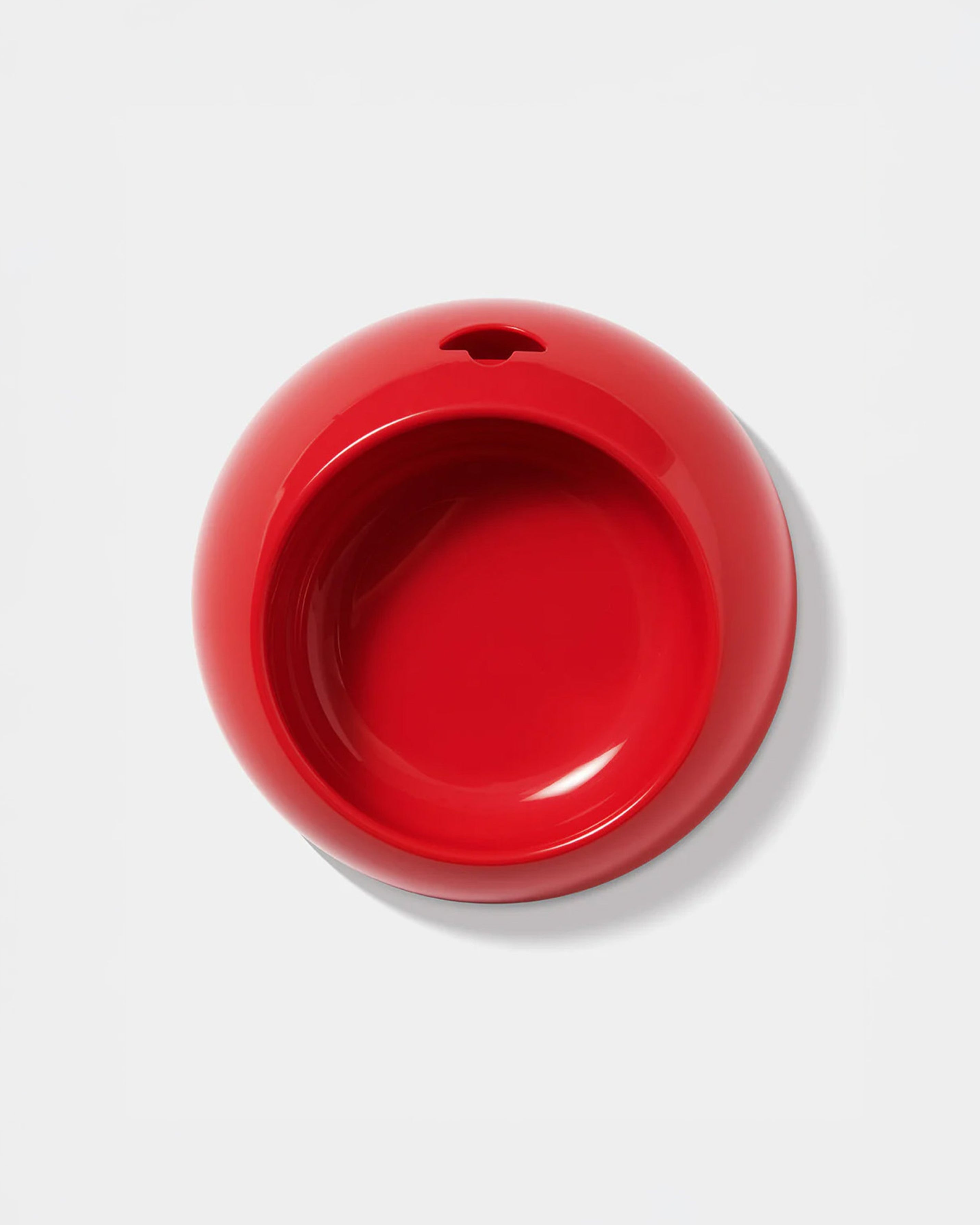 Red ceramic bowl on a white background