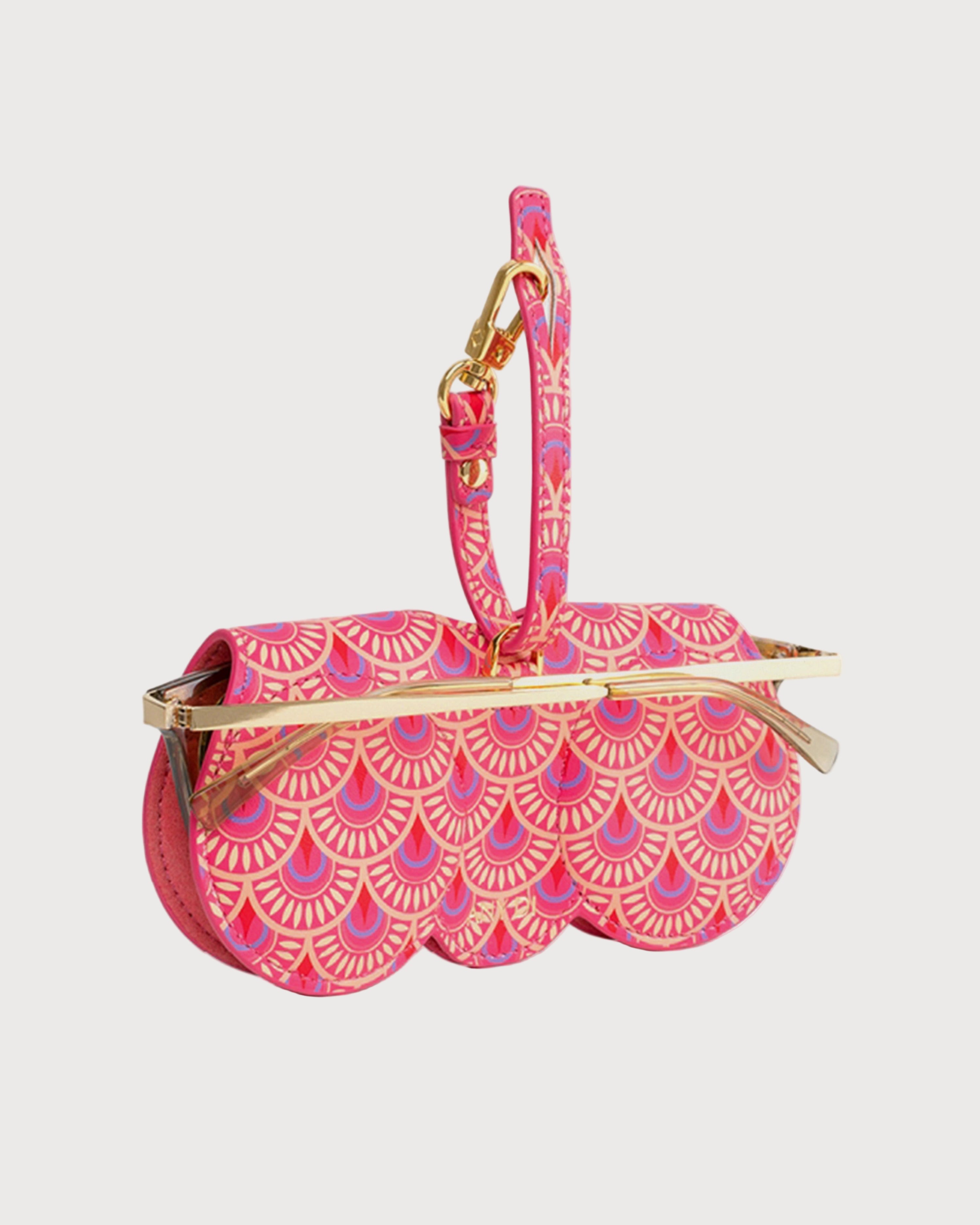 Aurora SunCover sunglasses case with floral silk-print pattern in red, orange and pink, round-edge shape and gold-plated hardware