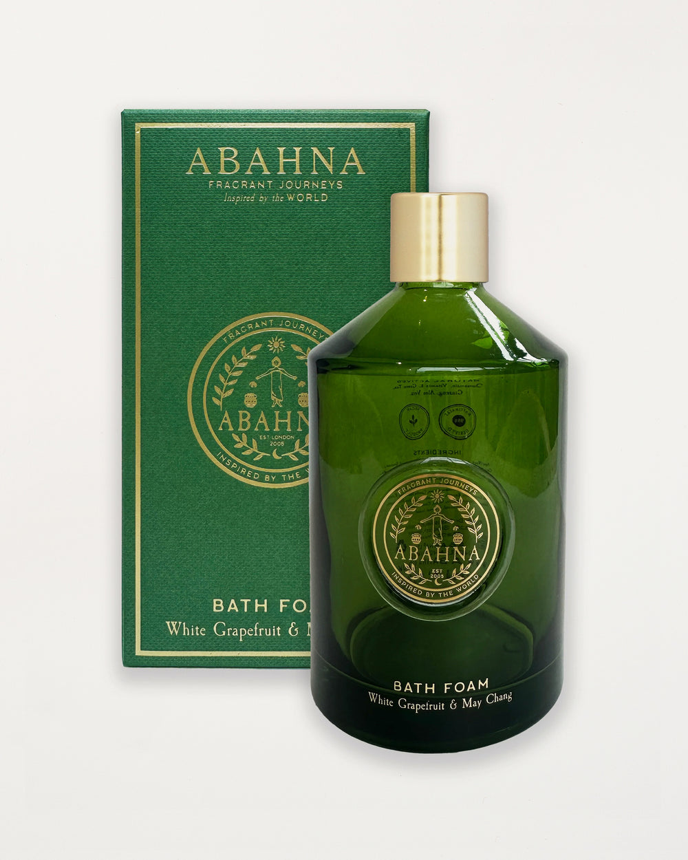 Green bath foam bottle with gold cap and 'Abahana' branding on a white background