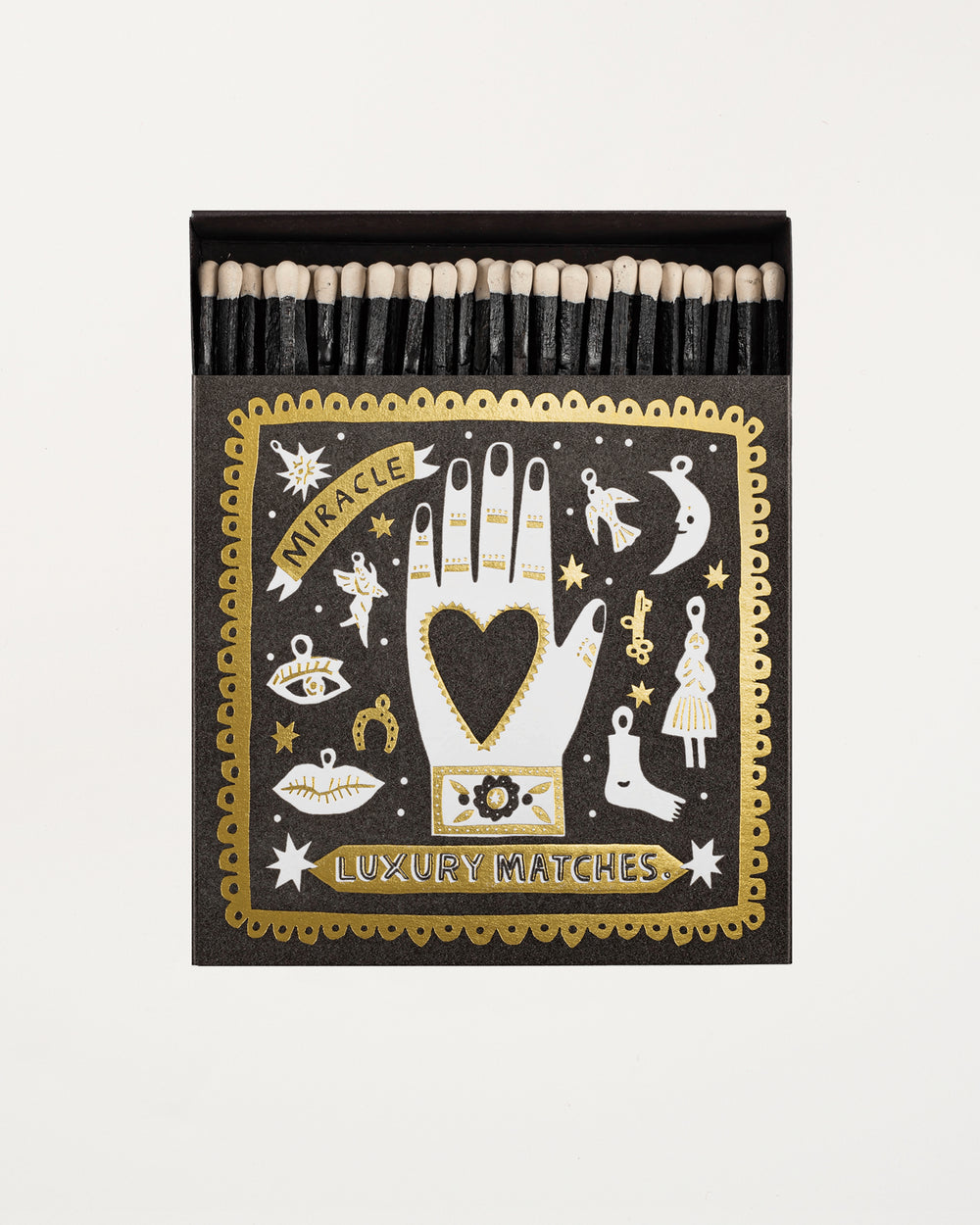Matchbox with decorative cover featuring illustrations and text on a white background