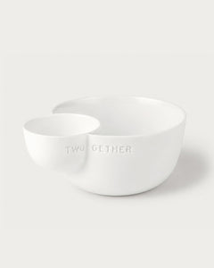 Two white ceramic bowls on a light gray background with 'TWOGETHER' text.