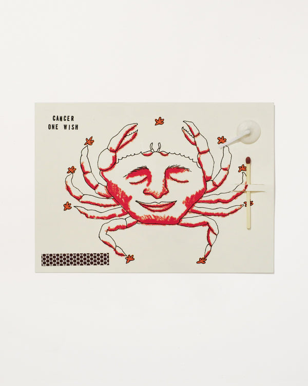Cancer Zodiac Wish Card with illustration of a smiling crab and text on a white background, containing a match, strike pad and candlewick
