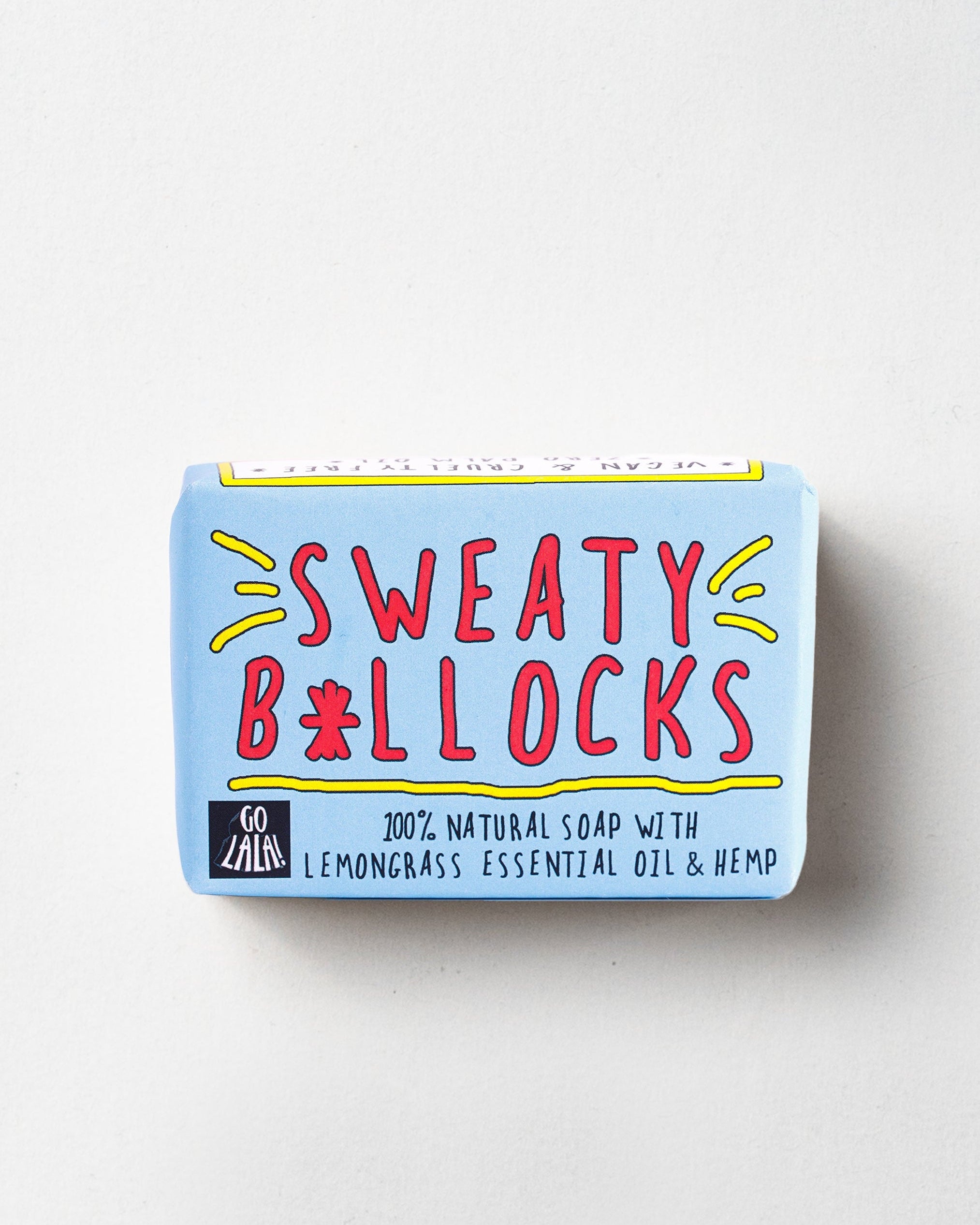 A bar of soap with the name 'Sweaty B*llocks' written on it, predominantly in a blue wrapper with colorful text and graphics.