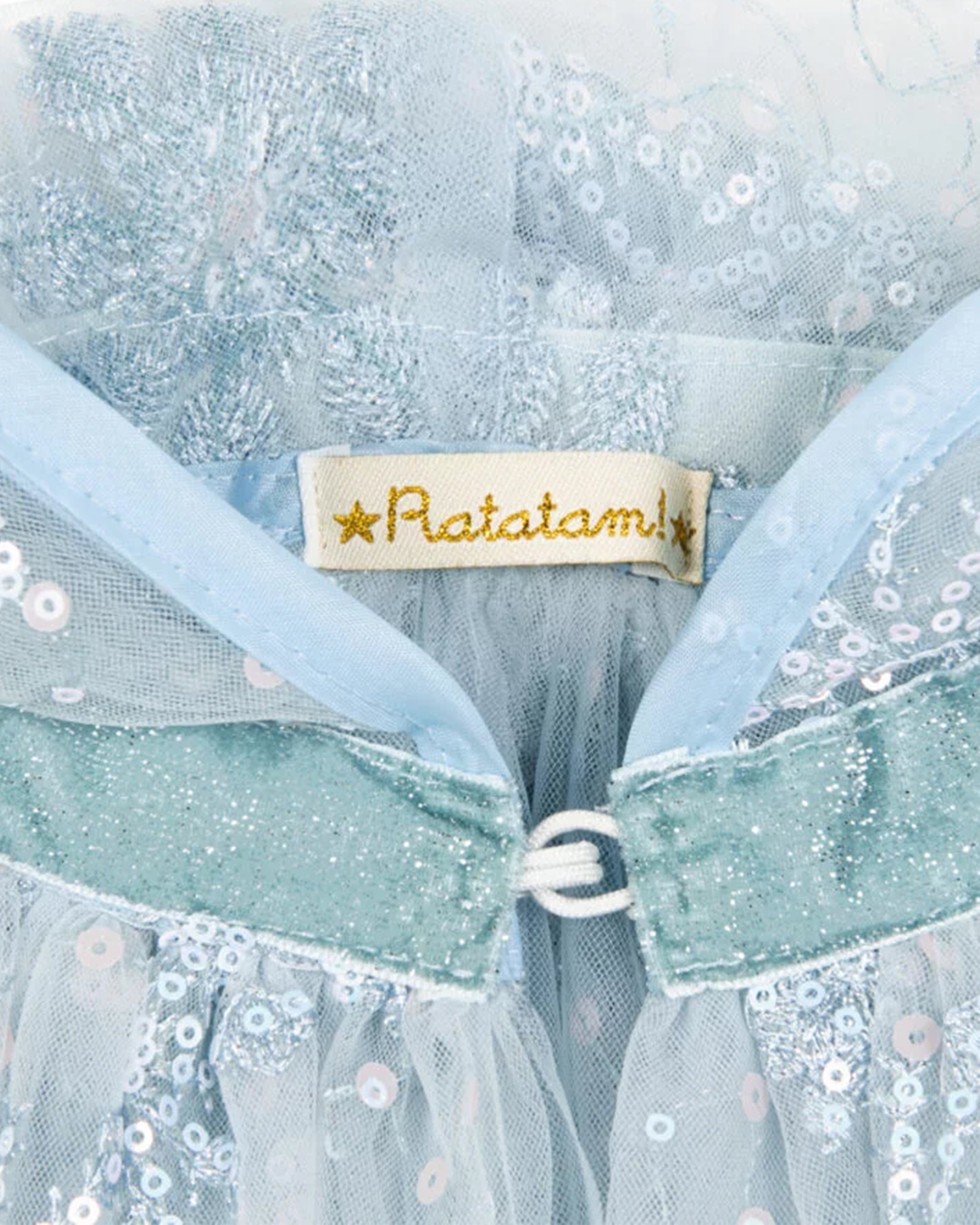 Close-up of a blue dress with floral details and a 'Ratatam' label.
